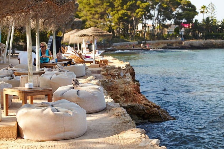 The 5 Hottest Beach Clubs in Ibiza to Hit This Summer